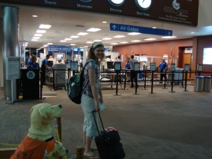 Me with my now-retired carry-on. I'm slightly hunched-down in this picture, and it's not because my backpack's heavy. 